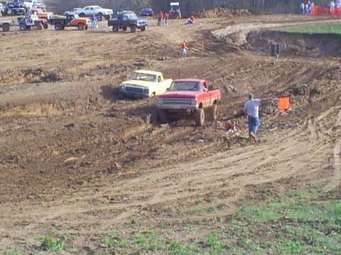 2001 Dodge 1500 - Multiple trucks compete in a mud race event on a challenging dirt track.