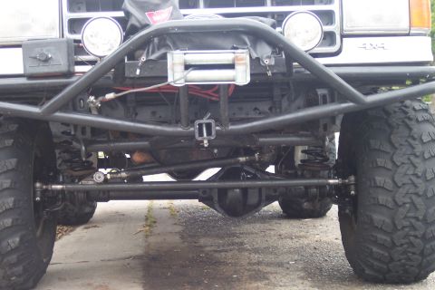 1989 Ford Bronco - Front view of a 1989 Ford Bronco with a winch and custom bumper.