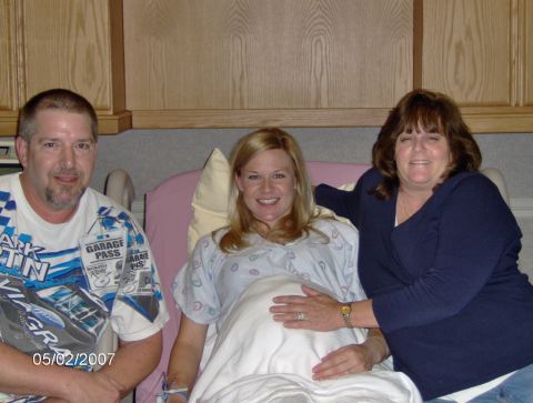 1978 Ford Bronco - A pregnant woman sits with two smiling companions in a hospital room.