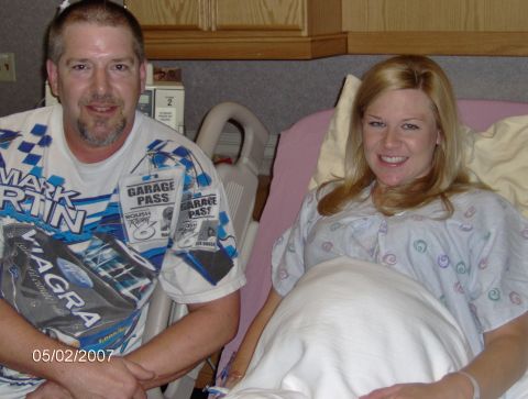 1978 Ford Bronco - A man and a pregnant woman smile for a photo in a hospital room.