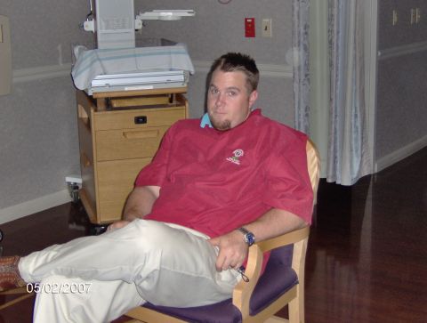 1978 Ford Bronco - A man sits in a chair in a room that appears to be a hospital or clinic, with medical equipment visible.