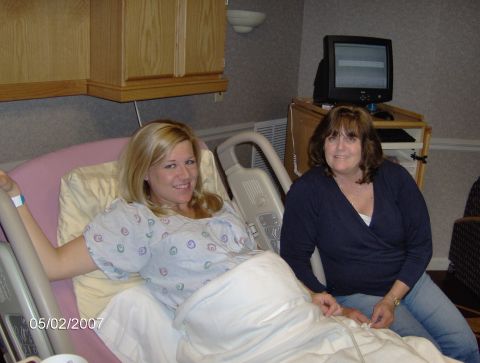 1978 Ford Bronco - A woman in a hospital gown smiles while sitting in a hospital bed, with another woman beside her.