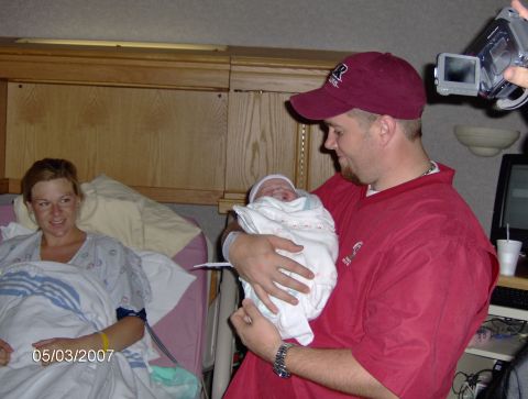 1978 Ford Bronco - A family celebrates the arrival of their newborn baby in a hospital room.
