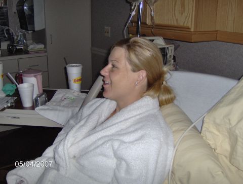 1978 Ford Bronco - A woman in a white hospital gown smiles while sitting in a bed, with medical equipment visible in the background. The photo is dated 05/04/…