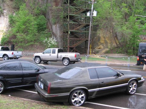 1998 GMC Sierra 1500 - Several vehicles are parked on a street, including a 1998 GMC Sierra 1500 pickup truck.