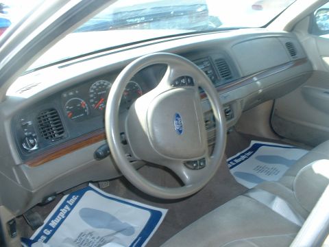 2000 Ford Crown Victoria - Interior view of a 2000 Ford Crown Victoria, the dashboard and steering wheel.