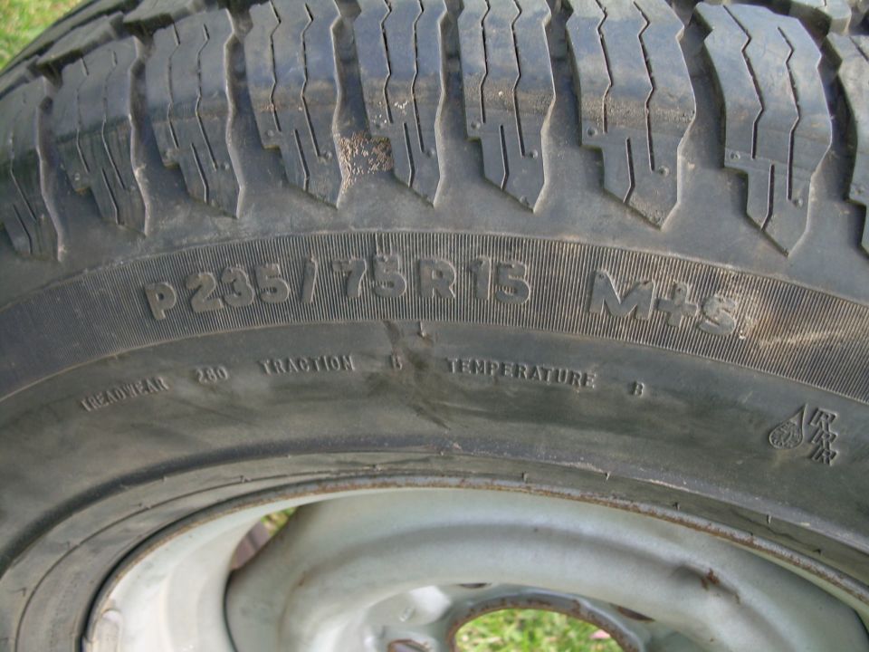 Close-up of a tire with P235/75R15 M+S markings