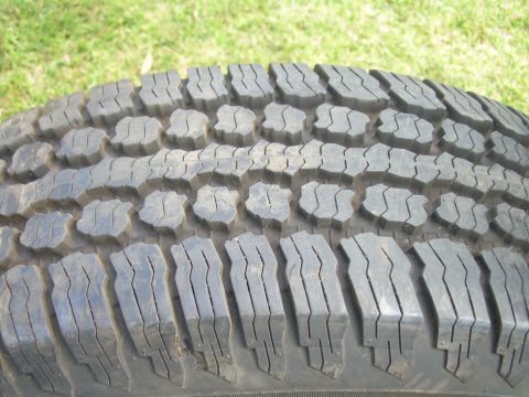 1986 Ford Bronco - Tire tread detail shows aggressive lug design for off-road traction.