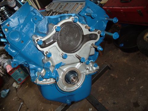 1990 Ford Ranger - Engine block assembly, likely a Ford 5.0L, painted blue with a silver front timing cover and visible crankshaft seal.