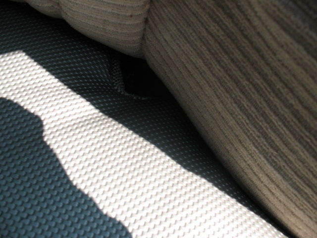 Close-up of automotive seat upholstery with black and white striped fabric