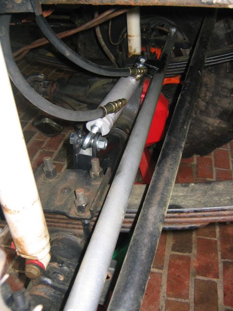 1979 Ford Bronco - Close-up view of the steering stabilizer and suspension components on a 1979 Ford Bronco.