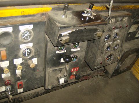 1996 Ford Probe - A close-up view of a complex control panel multiple gauges, switches, and levers.