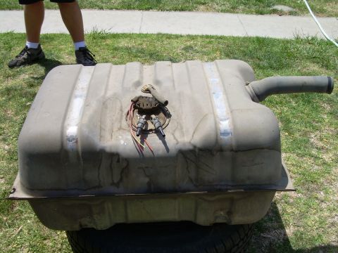 1986 Ford Bronco - This is a fuel tank, likely from a vehicle, shown with its fuel pump assembly and filler neck.