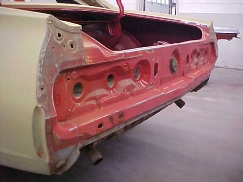 1967 Mercury Cougar - Rear view of a 1967 Mercury Cougar undergoing restoration, with the trunk open and taillight area exposed.
