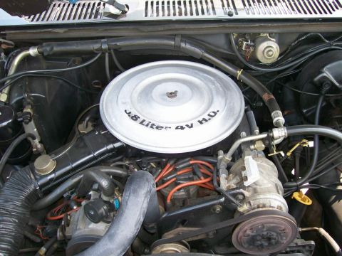 1984 Ford Bronco - Engine bay detail the air cleaner lid with "3.8 Liter 4V H.O." text.