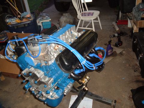 1990 Ford Ranger - Engine assembly with blue and silver paint, black valve covers, and blue spark plug wires.