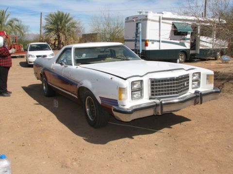 1973 Ford Ranchero - This 1977 Ford Ranchero features a distinctive grille and side stripe design, seen here in a three-quarter front view.