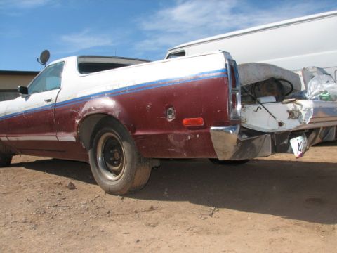 1973 Ford Ranchero - This Ford Ranchero shows its rear end, with a two-tone paint job and a loaded bed.