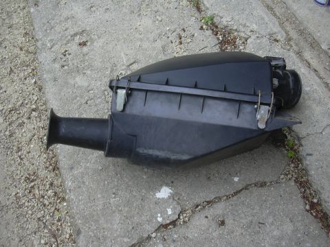 1996 Ford Crown Victoria - Air cleaner housing part shown on concrete ground.