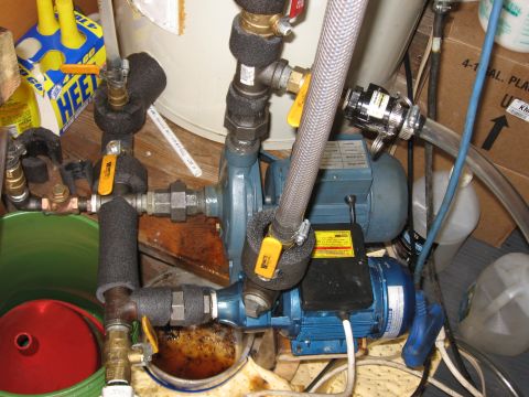 1980 Ford Bronco - A complex water pump system with multiple blue motors and yellow-handled valves is visible.