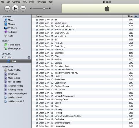 1985 Ford LTD Crown Victoria - Screenshot of the iTunes application showing a music library list of Green Day song titles and track times.