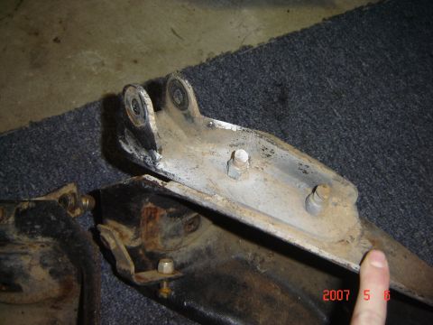 1993 Ford Bronco - These are some old suspension parts, possibly from a truck or SUV, showing signs of wear and rust.