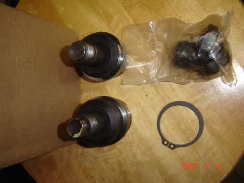 1993 Ford Bronco - New ball joints and a snap ring for a vehicle's suspension system.