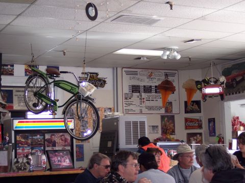 1972 Ford Ranchero - An ice cream shop interior features a suspended bicycle and a menu board displaying various treats.