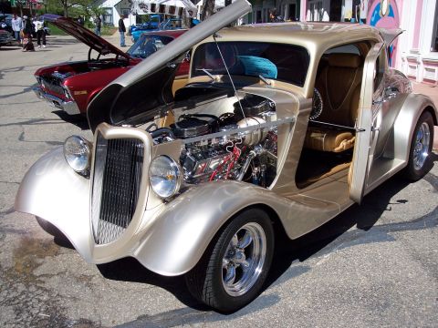 1972 Ford Ranchero - A custom coupe with a powerful engine is displayed at an outdoor event, with another vehicle nearby.
