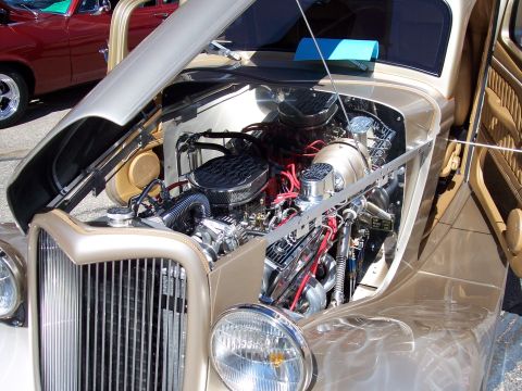 1972 Ford Ranchero - Engine bay of a custom hot rod, a V8 engine with chrome accents and air intake.