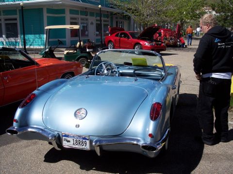 1972 Ford Ranchero - A light blue 1956 Chevrolet Corvette convertible is parked at an outdoor event, with other vehicles visible.