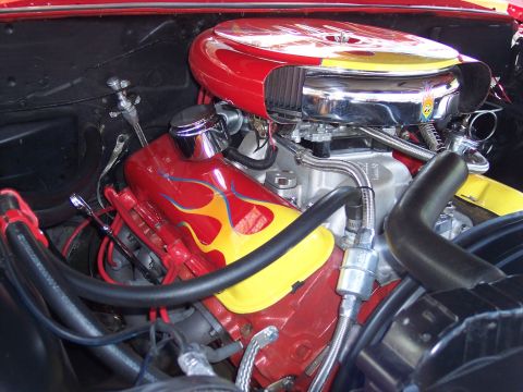 1972 Ford Ranchero - Close-up view of a customized engine bay vibrant flame decals on the valve covers and air cleaner assembly.