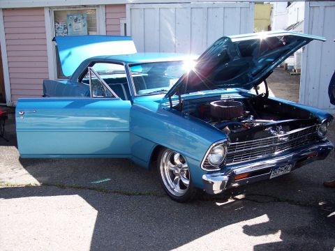 1972 Ford Ranchero - A light blue coupe sits with its hood and driver's door open, revealing the engine bay and interior.