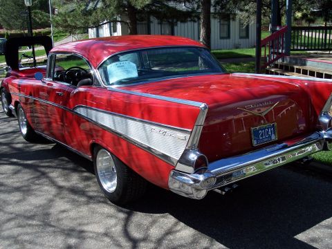 1972 Ford Ranchero - This red 1957 Chevrolet Bel Air features distinctive tail fins and chrome accents.