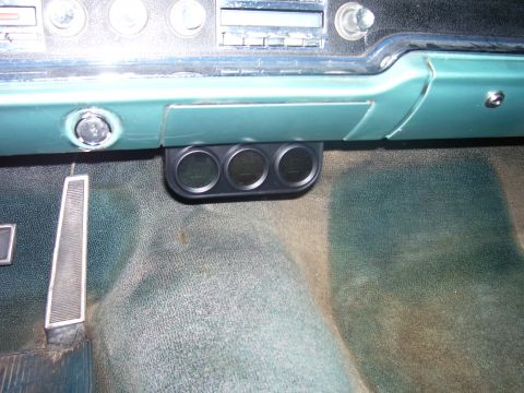 1965 Pontiac Catalina - Interior view of a 1965 Pontiac Catalina, showing a triple gauge pod installed below the dashboard.