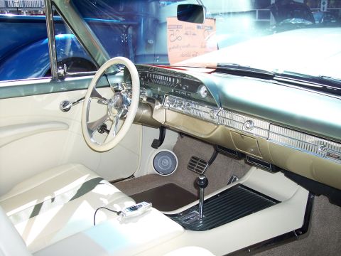 1972 Ford Ranchero - Interior of a 1959 Ford Fairlane 500 Skyliner, showing the dashboard, steering wheel, and seats.