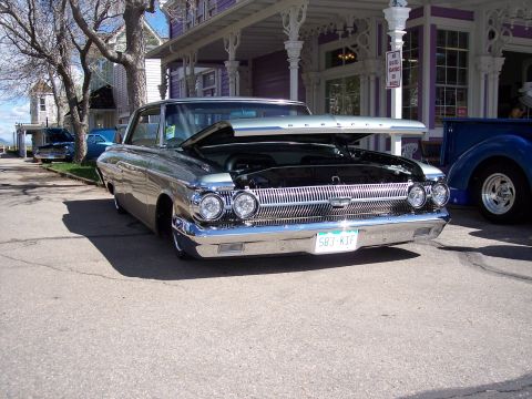 1972 Ford Ranchero - A 1960 Mercury Comet is parked with its hood open, revealing the engine bay and a prominent chrome grille.