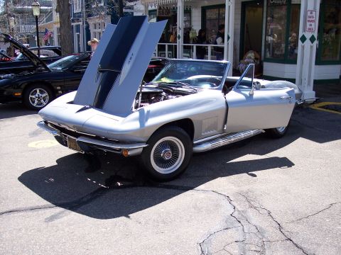 1972 Ford Ranchero - Silver 1965 Corvette Sting Ray convertible displays its engine with the hood open.