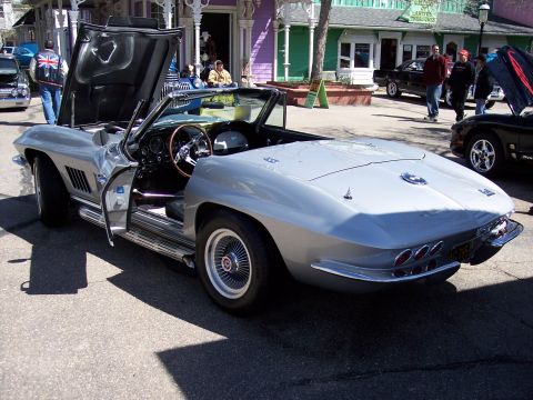 1972 Ford Ranchero - Silver 1963 Corvette Sting Ray convertible parked on street with hood and door open.