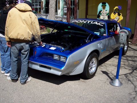 1972 Ford Ranchero - Blue and silver Pontiac Firebird with hood open, "PONTIAC" decal on windshield.