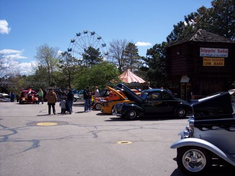 1972 Ford Ranchero - Cars are displayed at an outdoor event with a Ferris wheel and concessions stand.