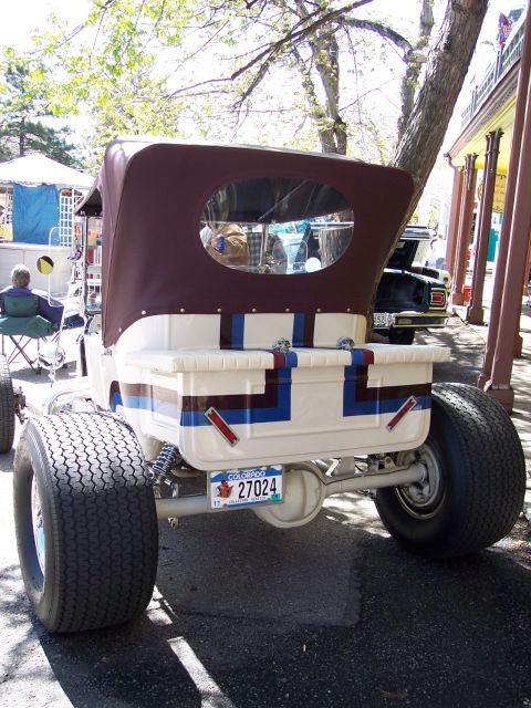 1972 Ford Ranchero - A custom hot rod pickup truck with a maroon soft top is parked outdoors, with another vehicle visible behind it.