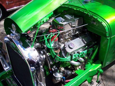 1972 Ford Ranchero - A custom hot rod's engine bay is visible, with a second vehicle in the background.