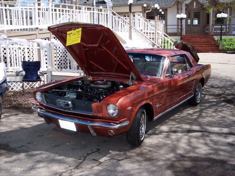 1972 Ford Ranchero - This 1965 Ford Mustang coupe is displayed with its hood open, revealing the engine bay.
