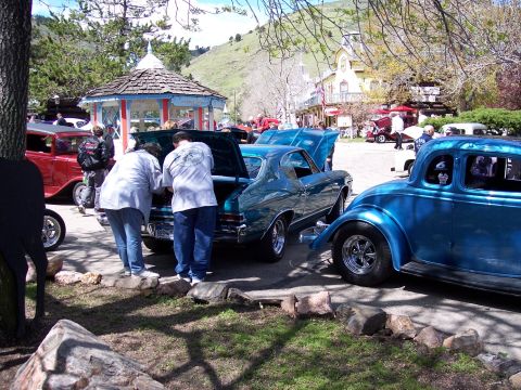 1972 Ford Ranchero - Two classic coupes are on display at an outdoor event.