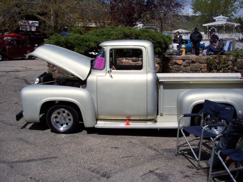 1972 Ford Ranchero - This silver pickup truck, likely from the mid-1950s, is displayed with its hood open, revealing the engine compartment.
