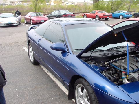 1989 Ford Probe - Blue 1989 Ford Probe in a parking lot, hood open showing the engine bay.