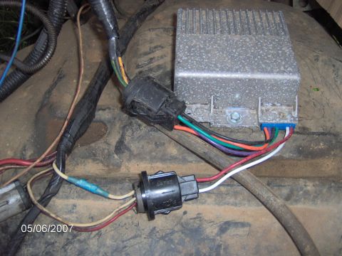 1985 Ford Bronco - Close-up view of an engine control module and its associated wiring harness.