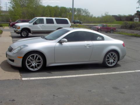 1989 Ford Probe - A silver coupe is parked in a lot with other vehicles visible in the background.