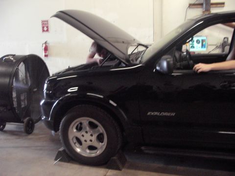1989 Ford Probe - Black SUV on a dynamometer with the hood up, showing "EXPLORER" badging.